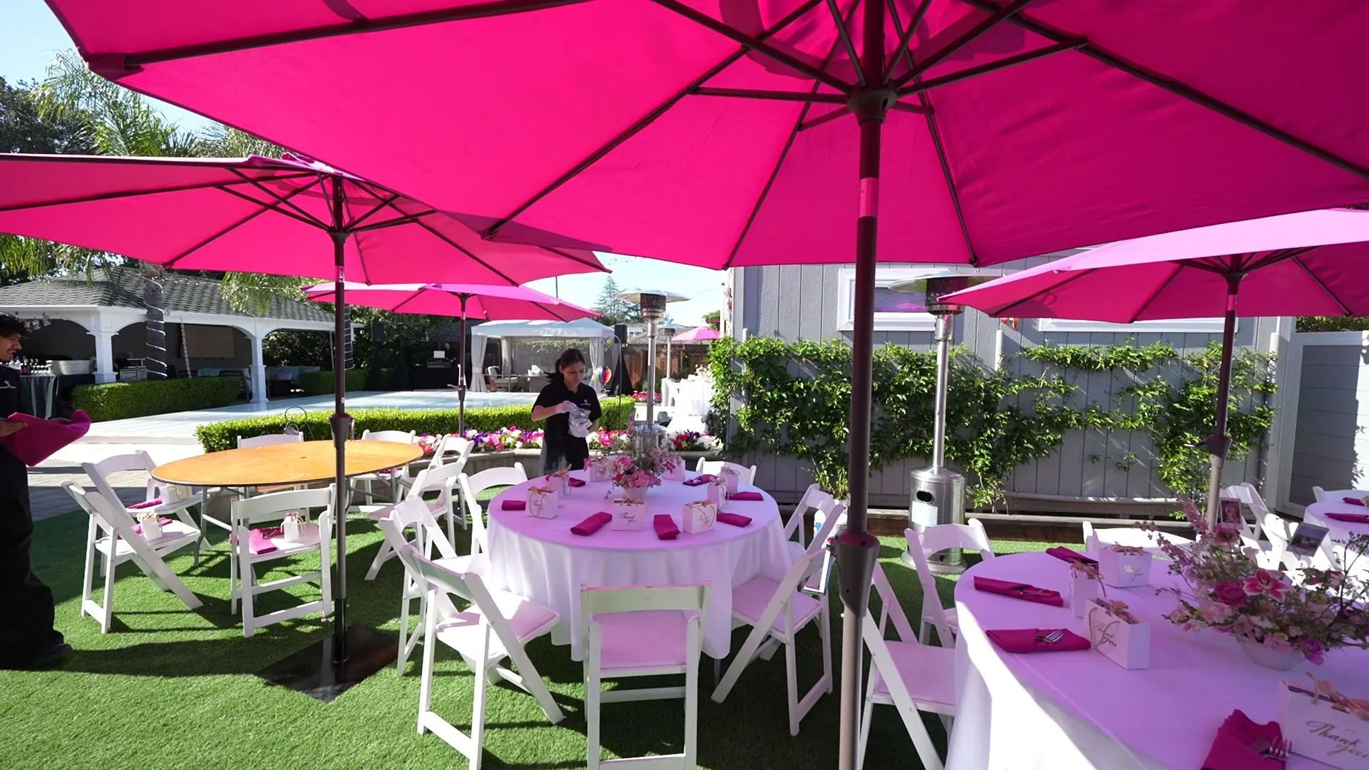 Umbrella-shaded patio lunch tables set for a UCSC faculty group
