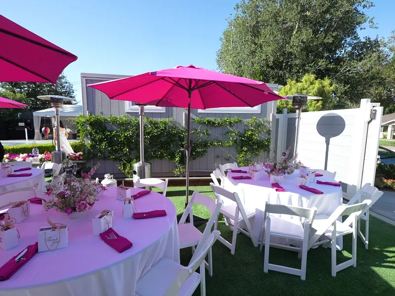 Shaded canopy seating arranged for a breezy Capitola afternoon event