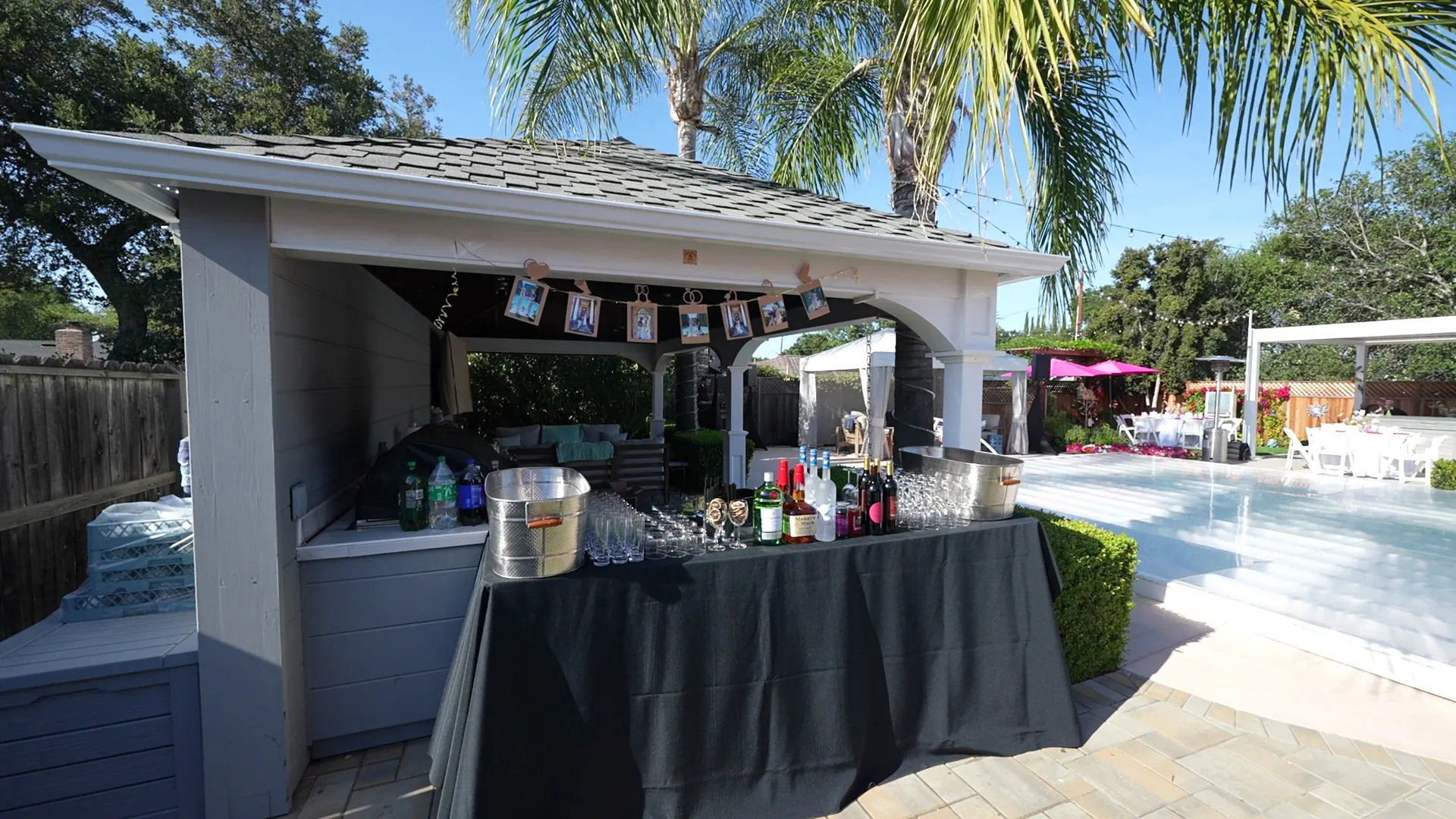 Beverage station set poolside for a warm-afternoon Watsonville party