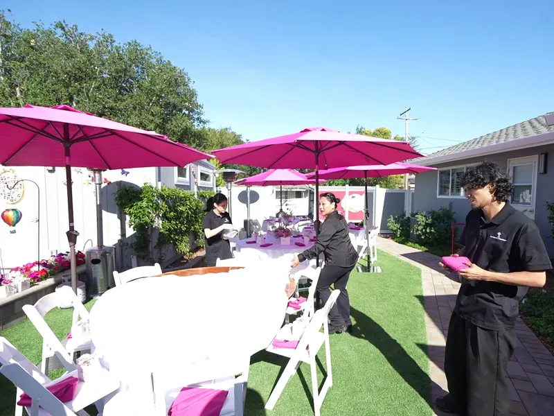 Round tables set in the sun for a UCSC celebration lunch