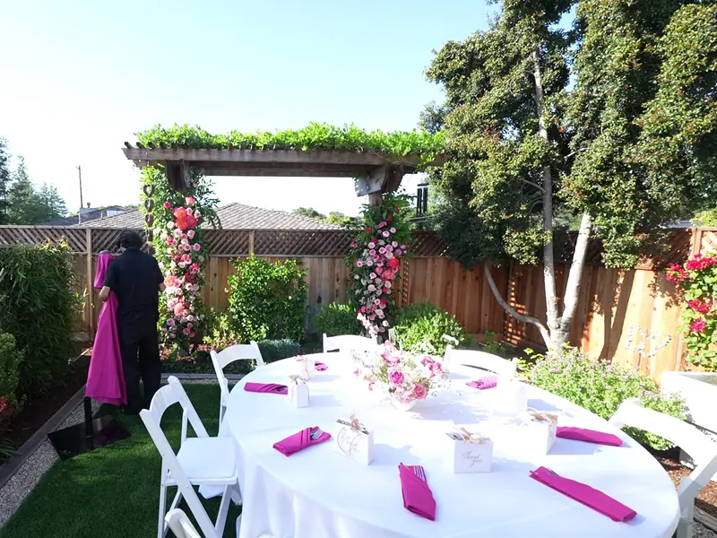Floral arch and set table for a Scotts Valley backyard celebration